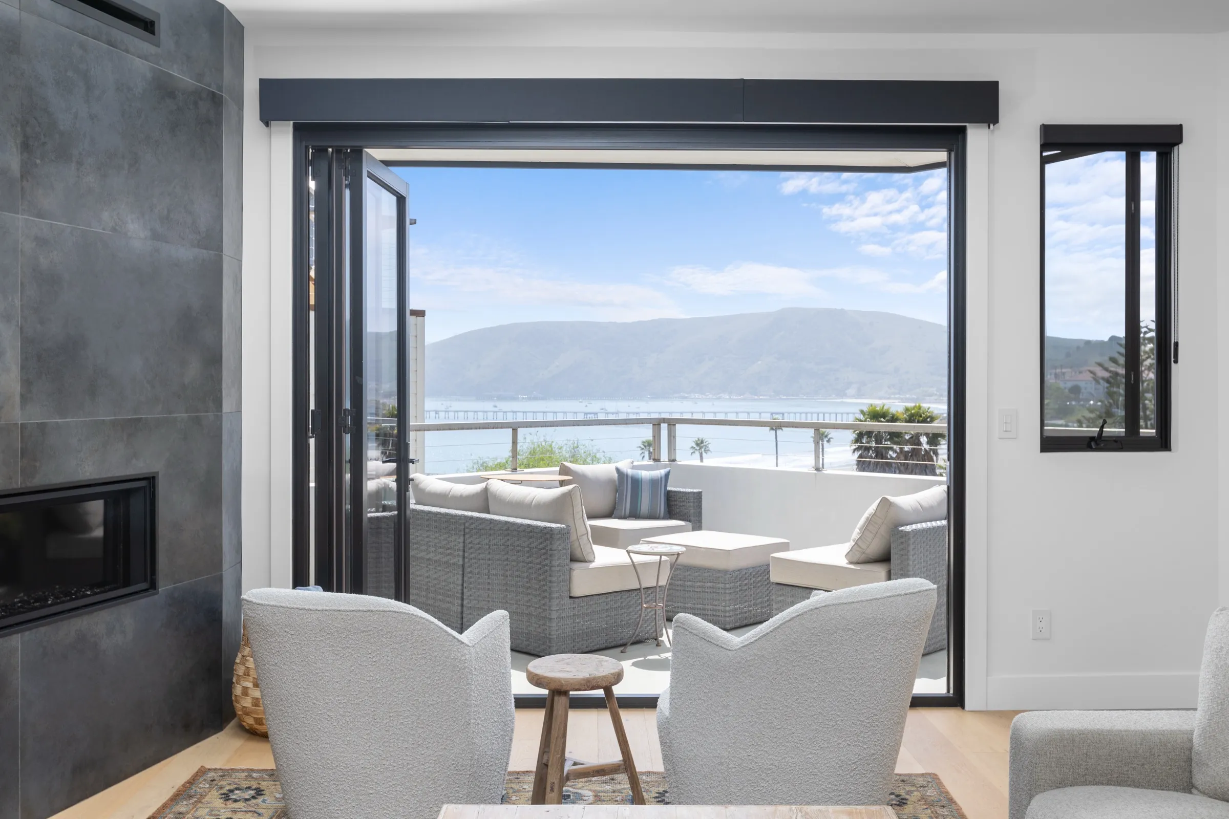 Living room opening onto an ocean-view patio in Avila Beach
